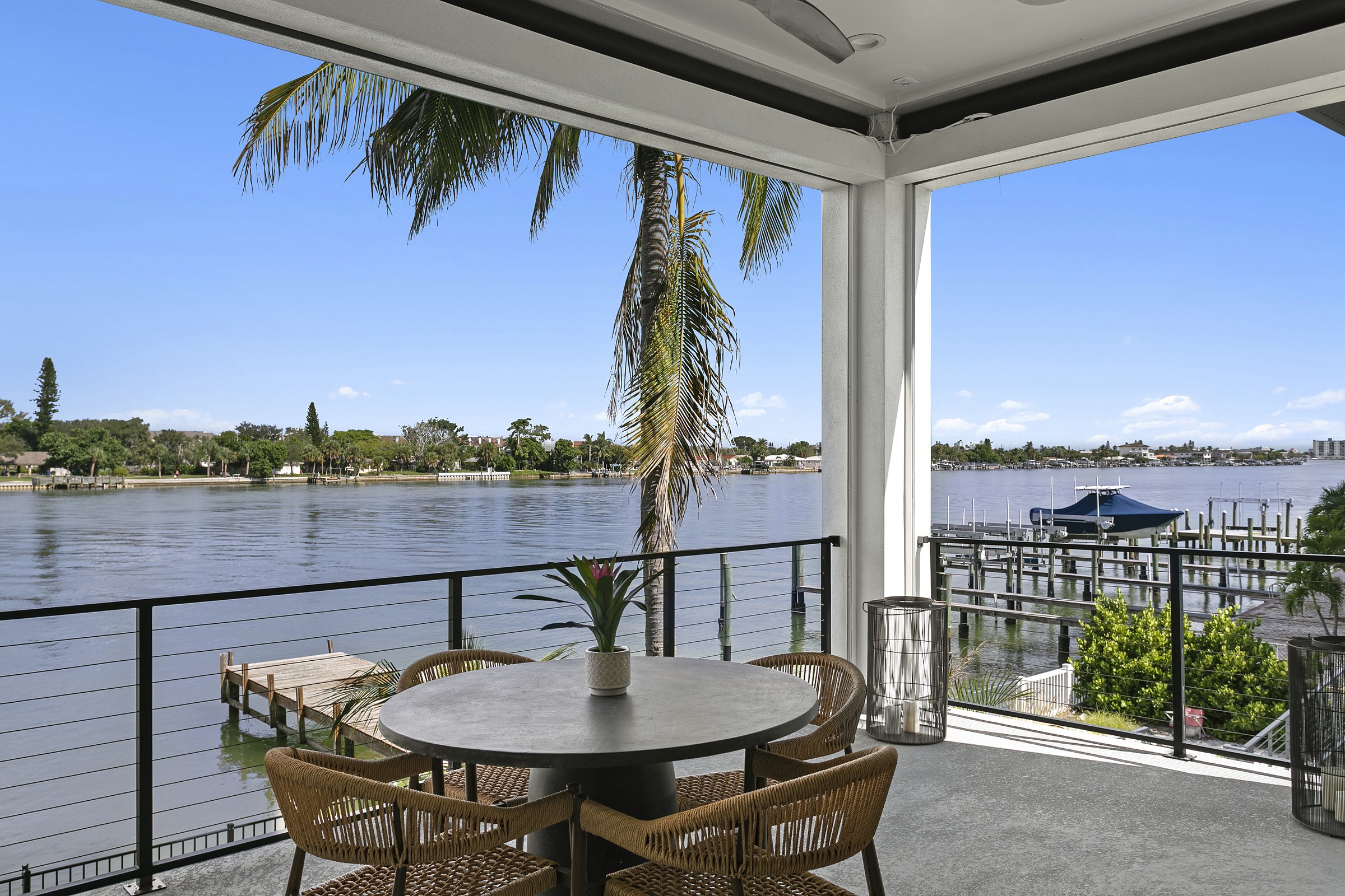 Covered balcony dining table over the water