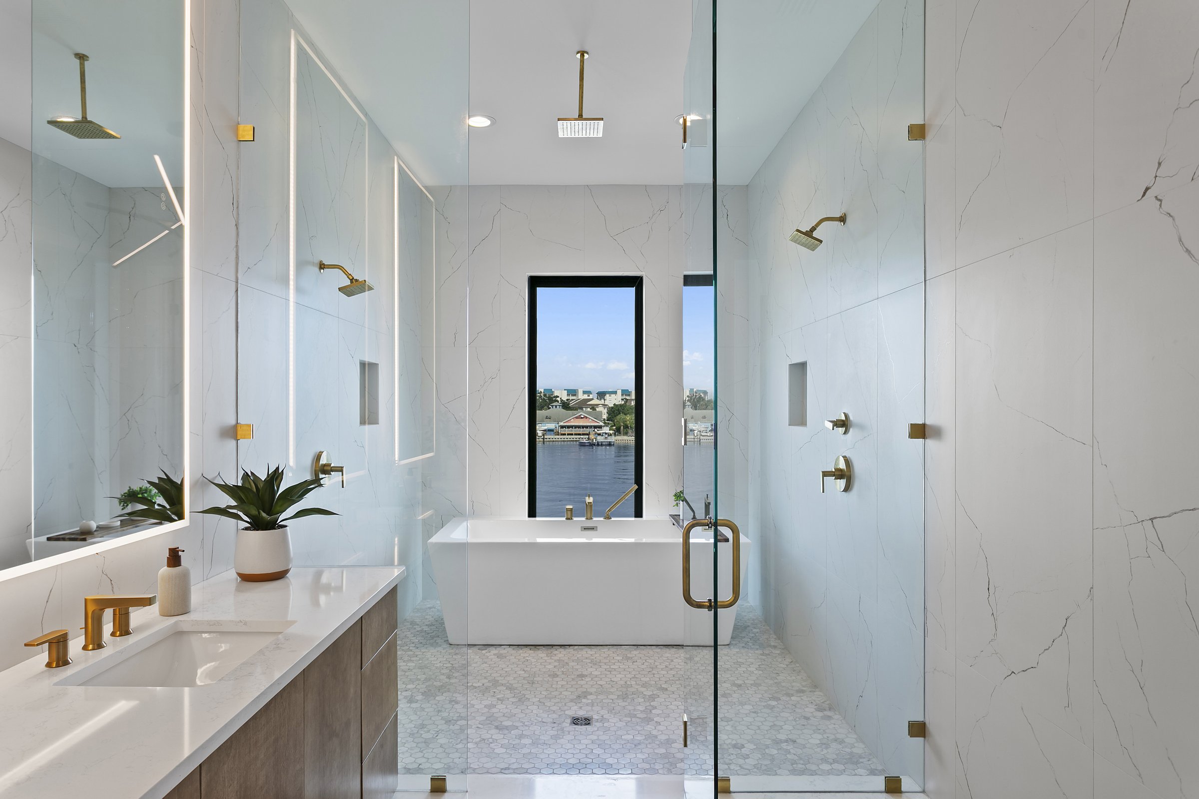 Primary bathroom wet room with freestanding soaking tub